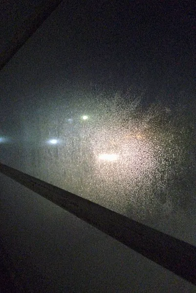 Condensation on a window at night